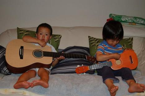 Kids playing guitar. Licensed through creative commons. 
